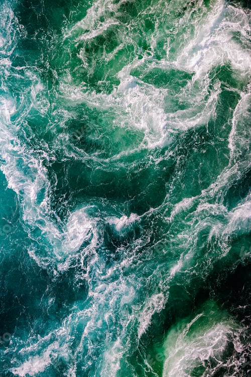 Preview: Blue waves of water of the river and the sea meet each other during high tide and low tide.
