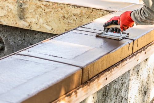 Preview: Construction Worker Using Hand Groover On Wet Cement Forming Coping Around New Pool