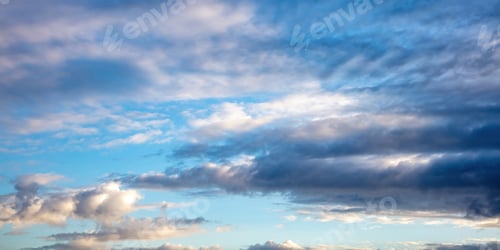 Preview: Cloud on blue sky background. Cloudscape grey and orange shade. Twilight light color the cloudy sky