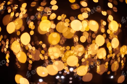 Preview: Yellow lights bokeh from christmas holiday garlands, blurred festive background, abstract lights
