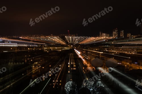 Preview: night cityscape with blurred bright illumination from windows