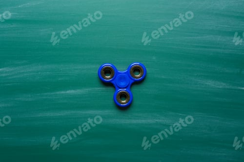 Preview: Blue spinner on a green chalkboard background