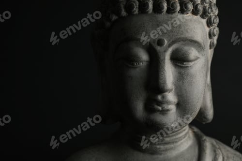 Preview: Beautiful stone Buddha sculpture on black background, closeup. Space for text