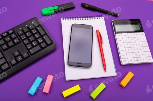 Preview: Modern workspace with calculator, smartphone and notebook on colorful background. Top view.