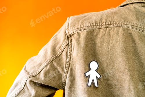 Preview: man with funny paper toy on jean jacket