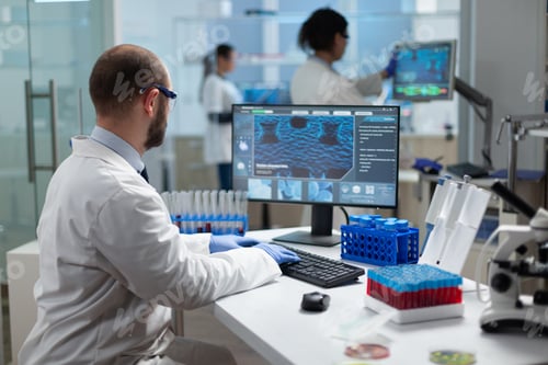 Preview: Chemist researcher doctor typing virus expertise working at coronavirus treatment