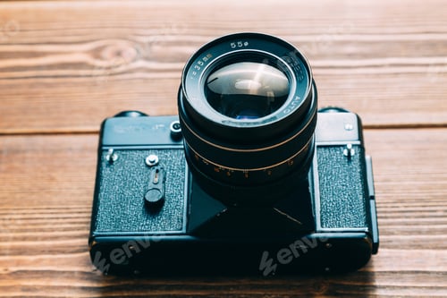 Preview: Old camera and on wooden table