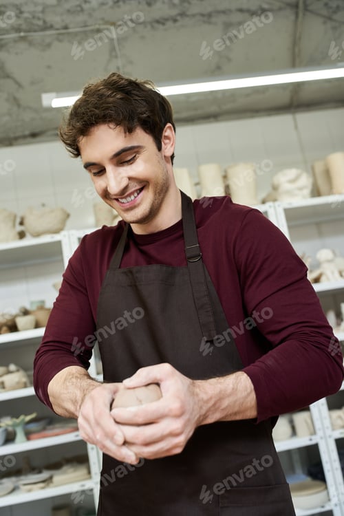 Preview: A joyful moment of pottery making between a loving couple in a modern studio