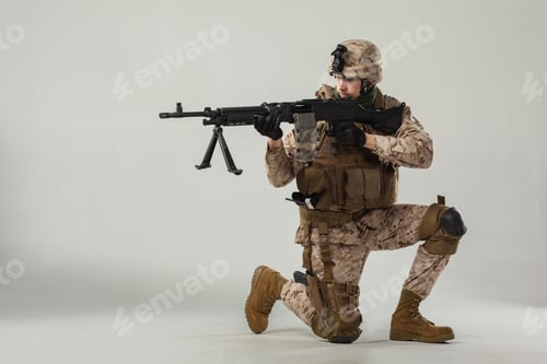 Preview: Soldier kneeling with weapon in a studio setting during a training session