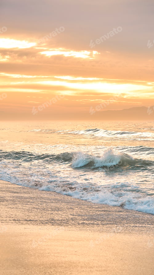 Preview: Beautiful Sunrise Morning Over Beach And Sea Looking Towards Mountains In South Africa