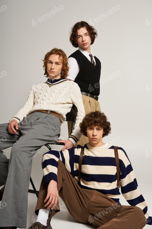 Preview: Young stylish friends showcase contemporary fashion in a modern studio setting