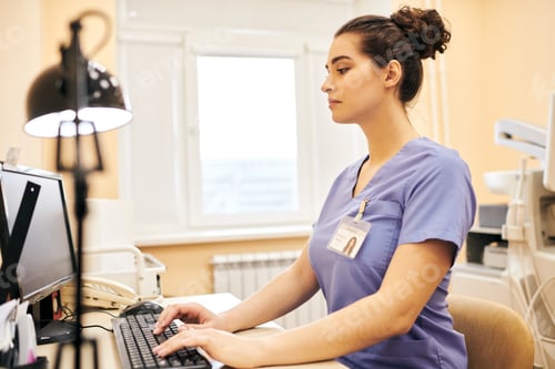 Preview: Medical clinic employee using computer
