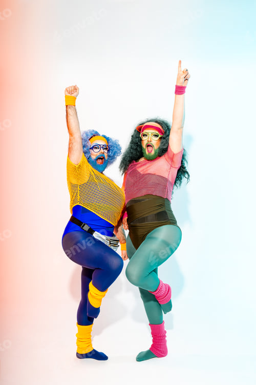 Preview: Two Darg Queens Standing Together with arms raised