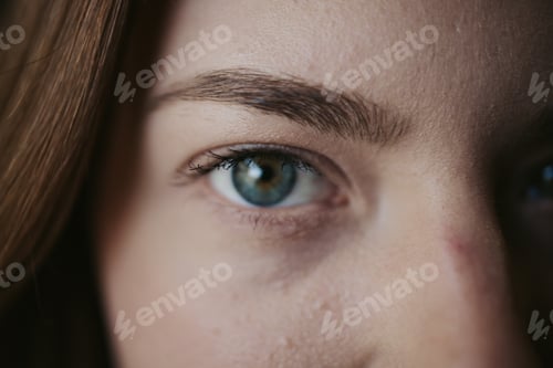 Preview: Closeup of a beautiful Bosnian woman staring into the camera with magical blue eyes
