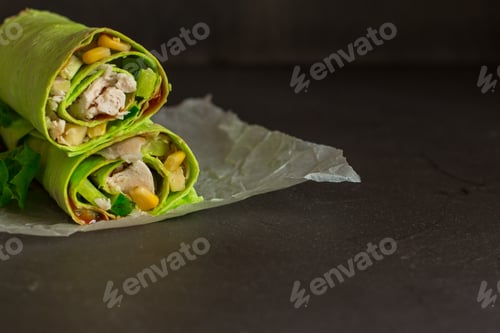 Preview: Burrito Green Spinach Wraps With Meat And Vegetables (Tortilla Wraps). Top View. Copy Space