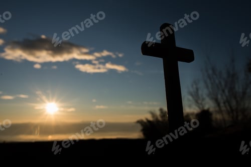 Preview: Silhouette of catholic cross and sunrise