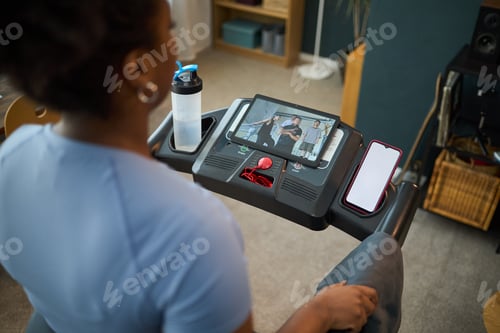 Preview: Person Engaging in Workout Using Treadmill
