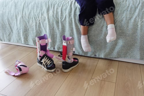 Preview: Child cerebral palsy disability, legs orthosis.