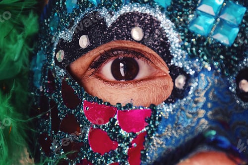 Preview: Single eye of woman wearing carnival mask