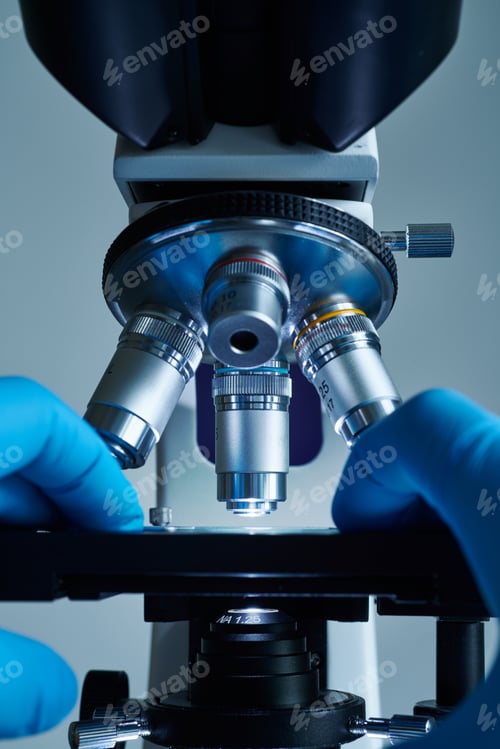 Preview: Scientist hands with microscope