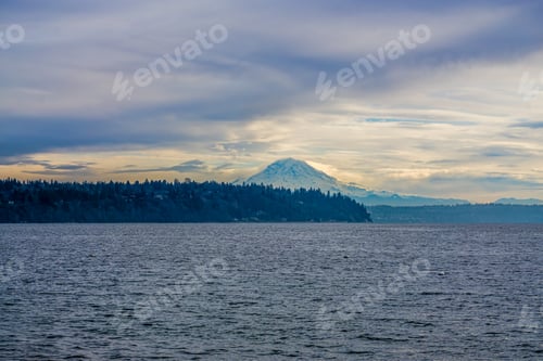 Preview: Clouds Hover Over Mount Rainier.