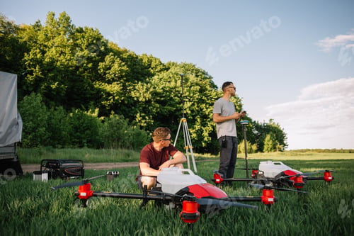 Preview: farmers set up agricultural drones before cultivating the fields.