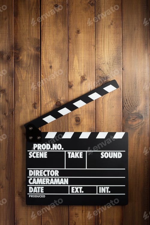 Preview: movie clapper board at wooden background