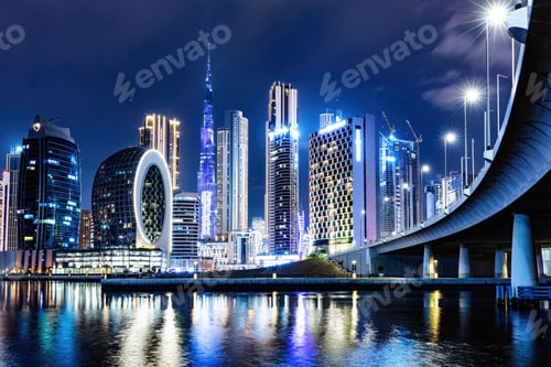 Preview: Skyscrapers skyline of Dubai UAE downtown with Burj Khalifa at night.