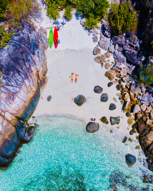 Preview: couple with a kayak on a small Island in front of the Island Ko Lipe Thailand
