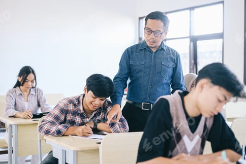 Preview: Teacher Helping Student