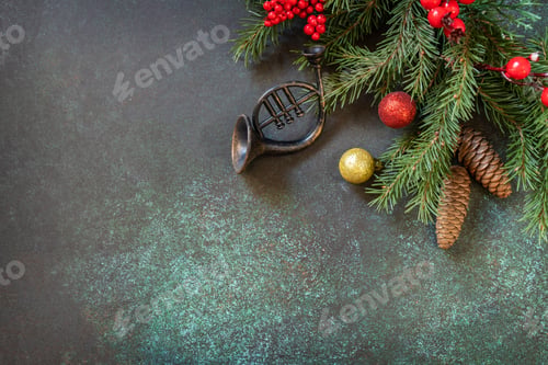 Preview: Fir tree branch and decoration on a dark stone.