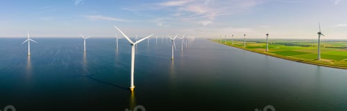 Preview: offshore windmill park with clouds and a blue sky