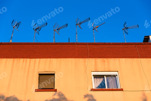 Preview: Several outdoor antennas to capture television signals on the roof of a building in Spain.