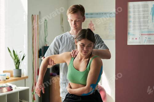 Preview: Physical Therapist Working With Patient Indoors