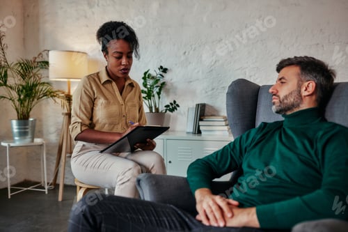 Preview: Man having a therapeutic session with a psychologist