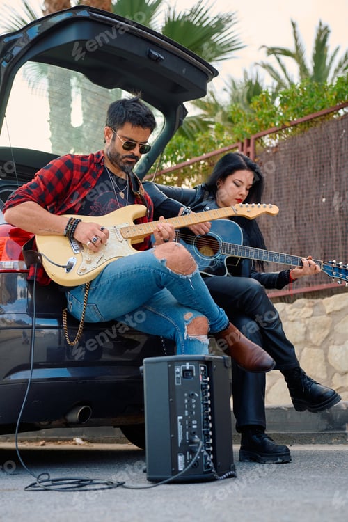 Preview: Musicians performing an acoustic set by a parked car under palm trees