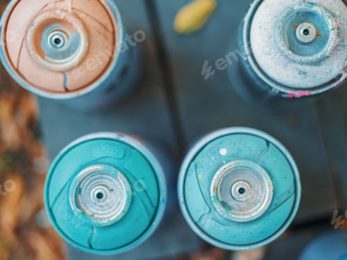 Preview: Used graffiti aerosol bottles sprays. Top view.
