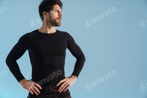 Preview: Handsome athletic sportsman posing and looking aside