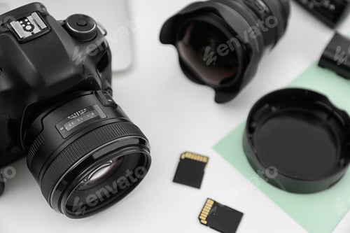 Preview: Equipment for photographer on table, focus on professional camera