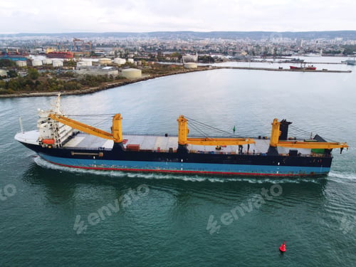Preview: Aerial drone view of Large empty car cargo ship entering the port in Varna