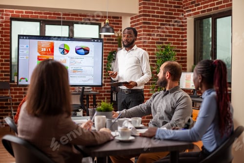 Preview: Man does project presentation in meeting