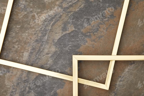 Preview: empty golden frames on stone background with copy space