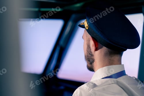 Preview: pilot in the cockpit controlling the plane during flight turbulence flight simulator transportation
