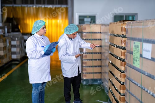 Preview: In warehouse quality control team checking drinking bottle stack on pallet before delivery