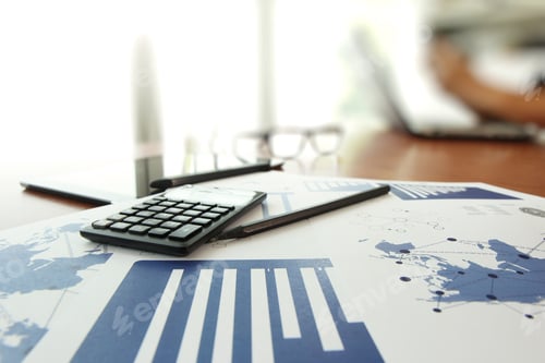 Preview: Business Documents On Office Table With Calculator And Digital Tablet And Man Working In The
