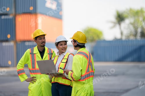 Preview: Construction workers collaborate on project planning at a busy shipping yard in the afternoon sun