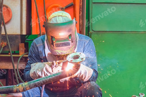 Preview: Welder is welding steel pipe for use in improving oil pipeline systems work in tanker ship