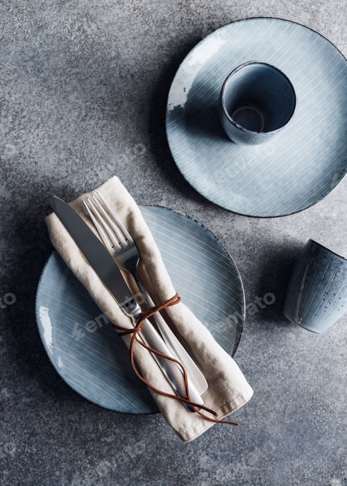 Preview: Served table setting with food blue ceramic set. Minimalist style, top view.