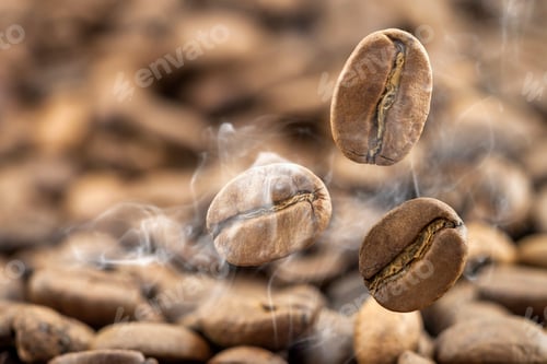 Preview: Flying fresh coffee beans as a background with copy space. Coffee beans falling down with white