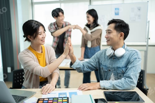 Preview: Group of asian creative team programing designers participate in all phases of the UX UI design.
